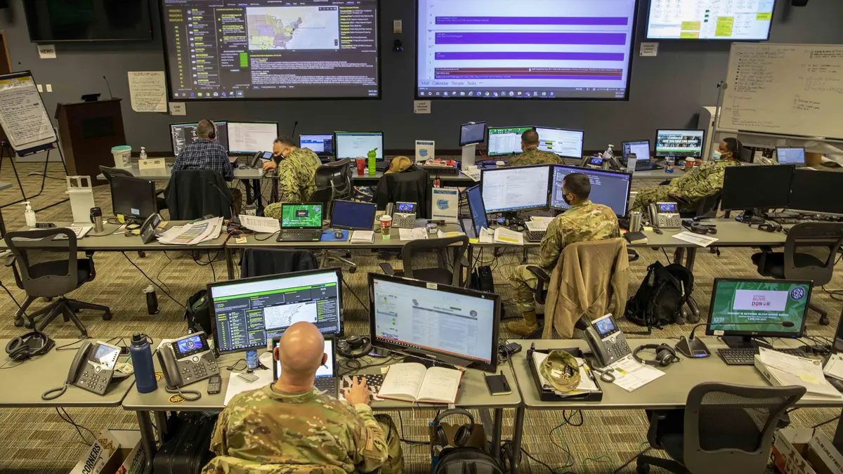 Military mission-command team coordinating operations from a secure command center